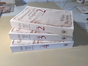Three of the four volumes in their original condition